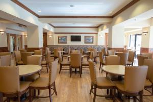 a room with tables and chairs and a tv at Music Road Resort Hotel and Inn in Pigeon Forge