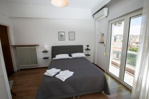 Posteľ alebo postele v izbe v ubytovaní Harmony Apartment Kavala