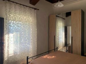 Ένα ή περισσότερα κρεβάτια σε δωμάτιο στο Casa Floridea