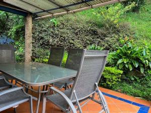 a table and chairs sitting on a patio at 300 squared meters house in the city! in Envigado