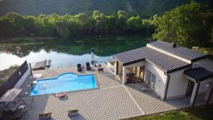 an aerial view of a house with a swimming pool at Villa Lux in Bosanska Krupa