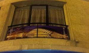 a window with a bed on top of it at Hostal Bisbal ONLY ADULTS NO AC in Valencia