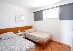 Postel nebo postele na pokoji v ubytování Apartamento Maypa 4 Arena
