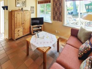 a living room with a couch and a coffee table at Holiday home in Ronneby in Ronneby