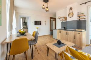 a kitchen and living room with a table and chairs at Villa Lеvandi in Sinemorets