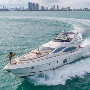 a woman on a boat in the water at Sol Miami #1 with free parking on premises in Miami