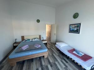 a bedroom with two beds in a room at Apartments Peronja Jelsa Seafront in Jelsa