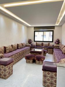 a large living room with couches and a table at Big appartment near soccer stadium in Tangier in Tangier