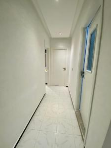 an empty hallway with white walls and a door at Big appartment near soccer stadium in Tangier in Tangier