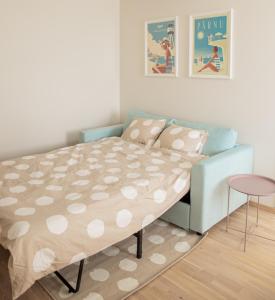 a bedroom with a bed and a table in it at Oja residents in Pärnu