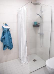 a bathroom with a shower curtain and a toilet at Oja residents in Pärnu
