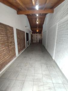 an empty hallway with a brick wall and a ceiling at Casa Familiar para hasta 6 personas , Lujan de Cuyo , Mendoza in Ciudad Lujan de Cuyo
