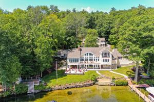 an aerial view of a large house with a river at Stoneybrook Retreat Haven in State Landing