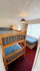 Ένα ή περισσότερα κρεβάτια σε δωμάτιο στο Hemsby Chalet Get Aways on Seadell Chalet Park