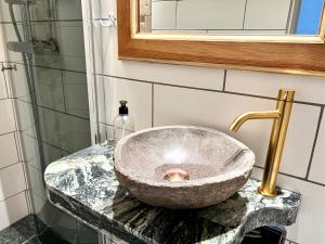 a bathroom with a bowl sink on a counter at Borghamn Strand in Borghamn