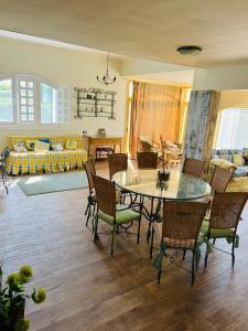 a living room with a table and chairs at Marina in El Alamein