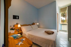 Llit o llits en una habitació de Vento Verde Apartments