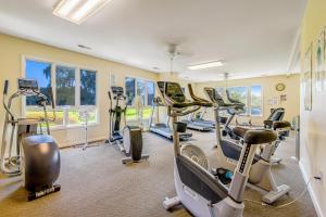 a gym with several treadmills and exercise bikes at Salt Pond --- 314 Walkabout Rd in Bethany Beach