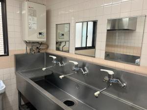 a bathroom with a stainless steel sink and mirrors at Himawari-Kan Standard room Male only - Vacation STAY 74345v in Yokohama