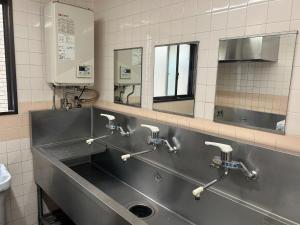 a bathroom with a stainless steel sink and mirrors at Himawari-Kan Standard room Female only - Vacation STAY 74387v in Yokohama