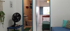 a room with a bed and a door to a bedroom at Marloah in Jericoacoara