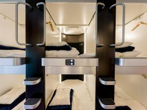a room with four bunk beds on a train at Yuraku Izu-Oshima - Vacation STAY 51863v in Oshima