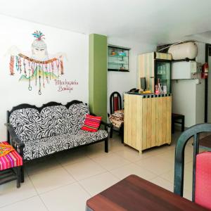 a living room with a couch and a table at MACHUPICCHU BOUTIQUE in Machu Picchu