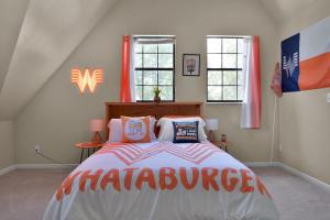 a bedroom with a bed with a marauder sign on it at Massive Texas Ranch House By Lake and Forest in Coldspring