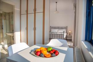 a bowl of fruit on a table in a room at Villa Rodanthi Sivota in Syvota