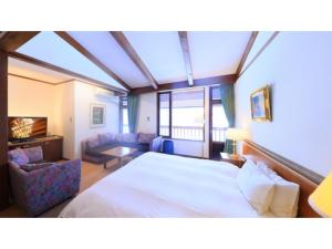 Een bed of bedden in een kamer bij Sukayu Onsen Hakkoda Hotel - Vacation STAY 66845v