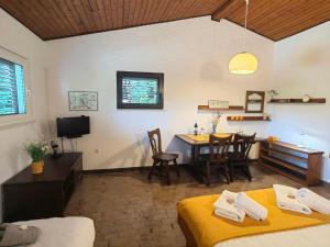 a room with a table and chairs and a dining room at Apartment Lada in Dramalj