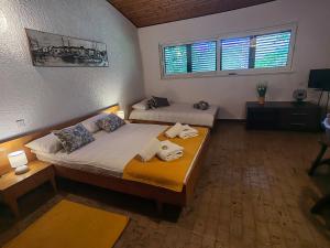 a bedroom with two beds and a window at Apartment Lada in Dramalj