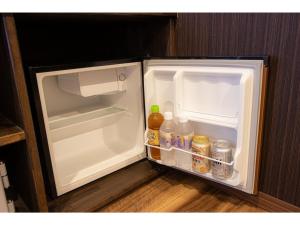 an open refrigerator with food and drinks in it at Oita Onsen Business Resort Sourin - Vacation STAY 73386v in Oita