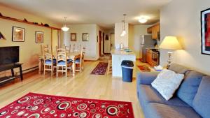 a living room with a couch and a table and a kitchen at 135 Marina Place in Dillon