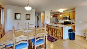 a kitchen and dining room with a wooden table at 135 Marina Place in Dillon