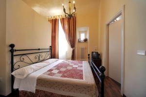 Postel nebo postele na pokoji v ubytování Hotel Iris