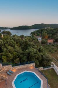 an overhead view of a swimming pool and a lake at Villa Rodanthi Sivota in Sivota