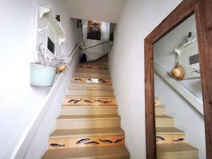 a stairwell with a wooden door and a staircase with stairs at Charming Portuguese style apartment, for rent "Vida à Portuguesa", "Gaivota" Alojamento Local in Portimão