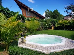 a hot tub in the yard of a house at Villa 1 in Jarabacoa