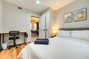 a bedroom with a bed and a desk and a chair at WFH-Friendly Tampa Home Rental 2 Mi to Downtown! in Tampa