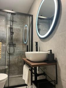 a bathroom with a sink and a mirror at Apartment Ante in Split