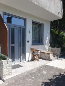 a house with a table and a glass door at Harmony apartments in Portorož