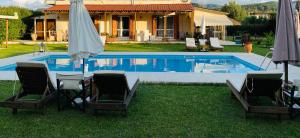 The swimming pool at or close to THE MANSION OF DIONISOS AND DIMITRAS
