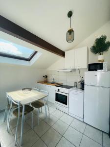 Køkken eller tekøkken på Appartement L'Annexe City - 3 étoiles