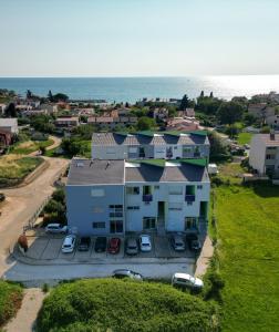 an aerial view of a house with a parking lot at Apartment Hana in Zambratija