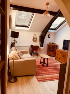 a living room with a couch and a table at Leicester city centre flat in Leicester