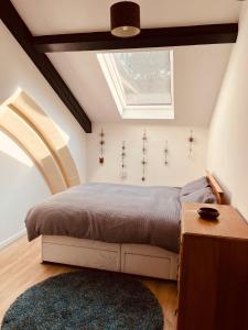 a bedroom with a bed and a skylight at Leicester city centre flat in Leicester