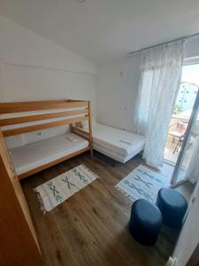 Posteľ alebo postele v izbe v ubytovaní Apartman Hana
