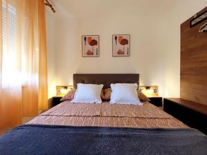 Postel nebo postele na pokoji v ubytování Apartments Jolić