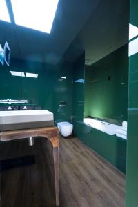 a bathroom with a sink and a toilet in it at Figueira by The Beautique Hotels in Lisbon